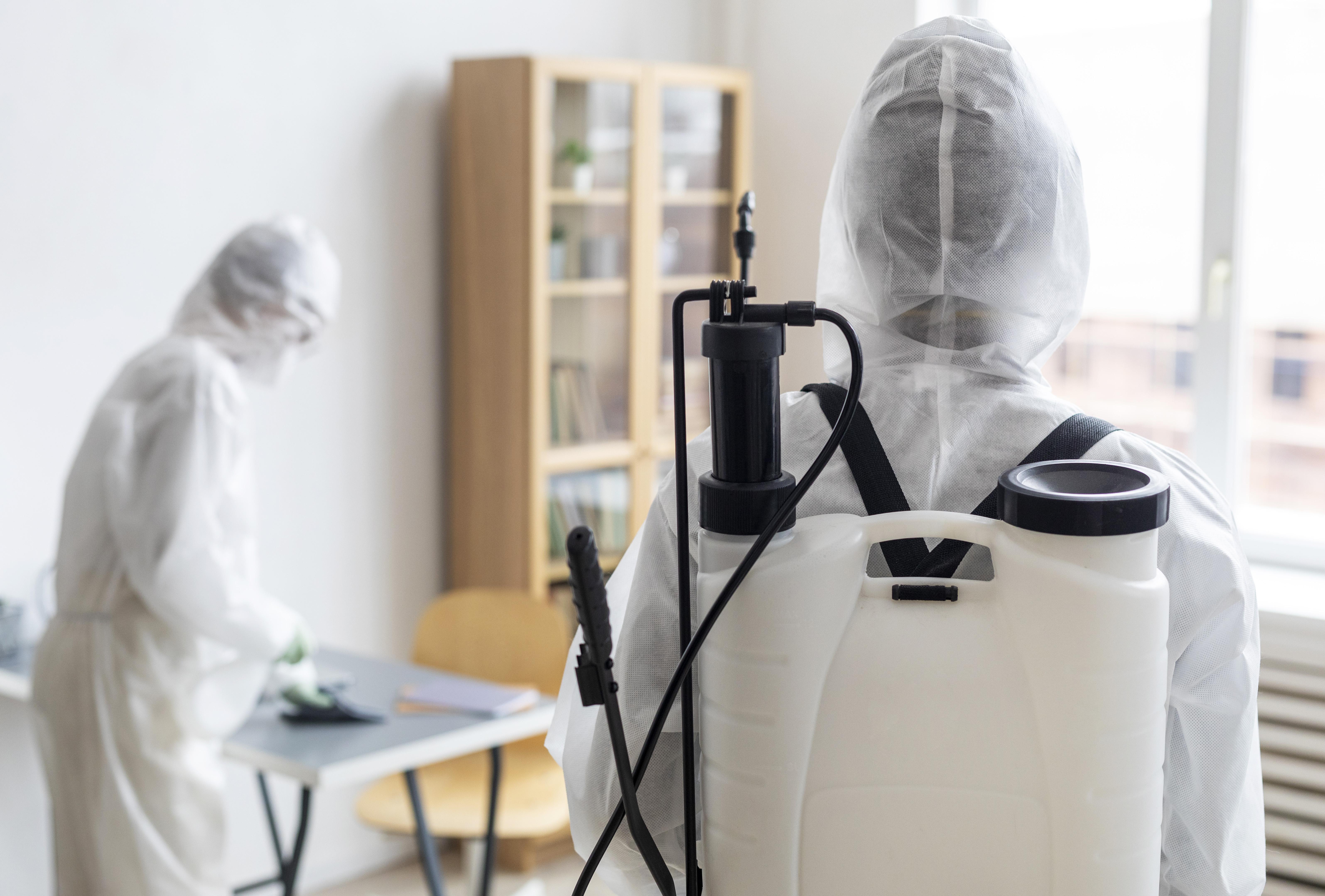 Pest control technician providing treatment service